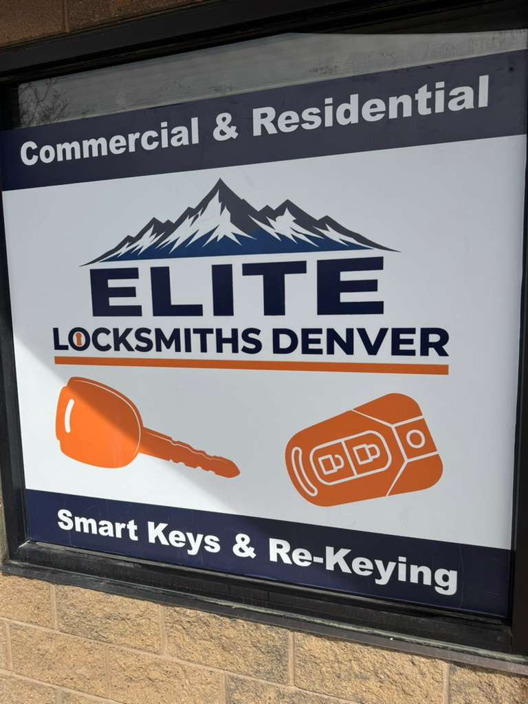 Elite Locksmiths Denver storefront window signage showing Commercial and Residential services